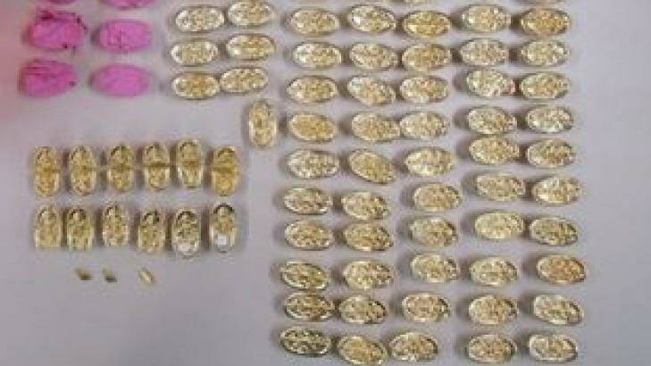 Police seized allegedly fake gold ingots from a Pyrmont hotel room. Photo: Police Media