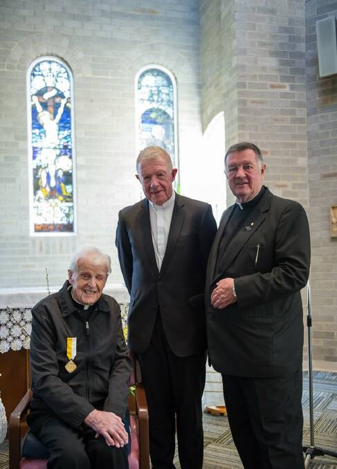 SYDNEY’S oldest priest, Father Frank Martin, 98, of Cronulla, pictured with Bishop Terry Brady and Monsignor Brian Rayner, has received a Papal Honour for his work with the church and the community. 
