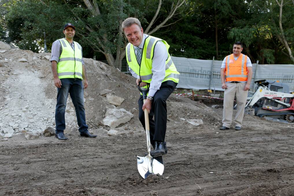 New look: Rockdale mayor Shane O'Brien breaks ground on new sporting amenities at Gardiner Park, watched by Nour Hijazi and Habib Mehdi from Banksia Football Club. Picture: Jane Dyson
