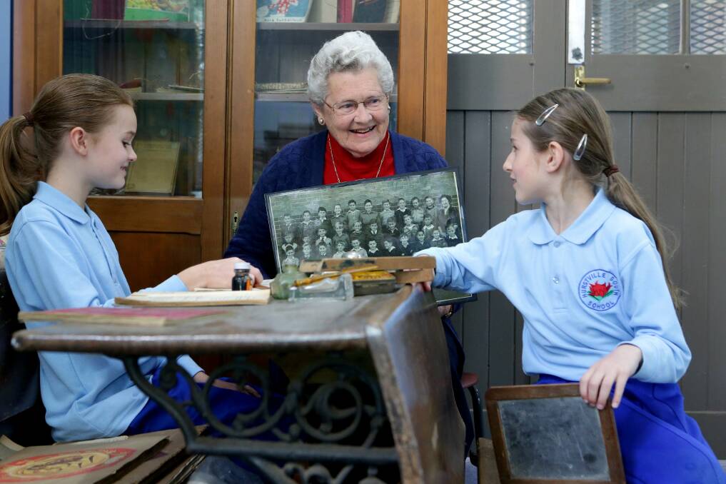 Days gone by: Former student of Hurstville South Public School, Gloria Marsh, took children for a trip down memory lane recently, when she visited classrooms. She is pictured with Sophie Pitt, whose grandparents taught at the school in the late 1970s/early 1980s, and Angelique Malakonakis, whose parents and other relatives attended the school. Picture: Jane Dyson