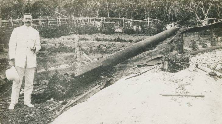 Tennis court undamaged: The wireless operator who sent the SOS call that brought HMAS Sydney to the area, standing next to the wireless mast destroyed by the German raiding party. Photo: Argus Collection, Fairfax Photographic 