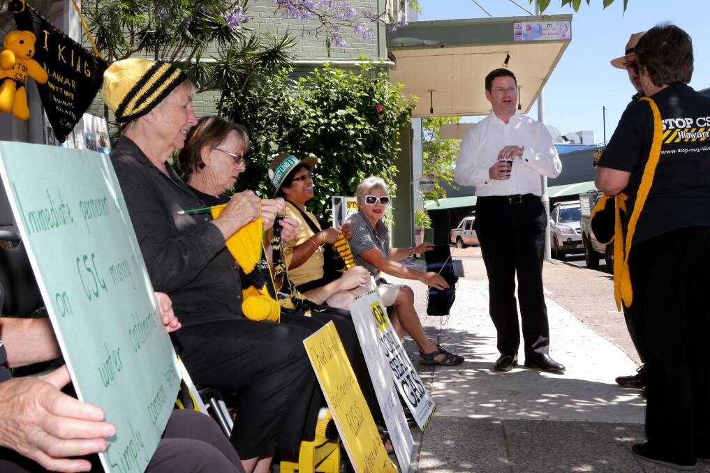 The plain and purl of it: The knitting nannas at Mark Coure's (also pictured) office. Picture: Jane Dyson
