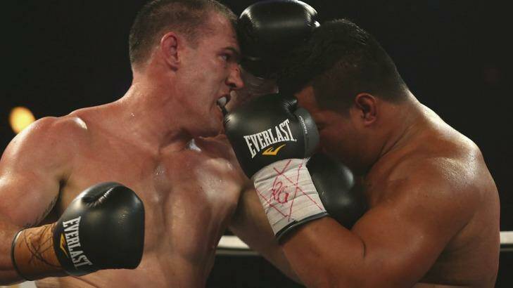 Paul Gallen trades punches with Herman Purcell.