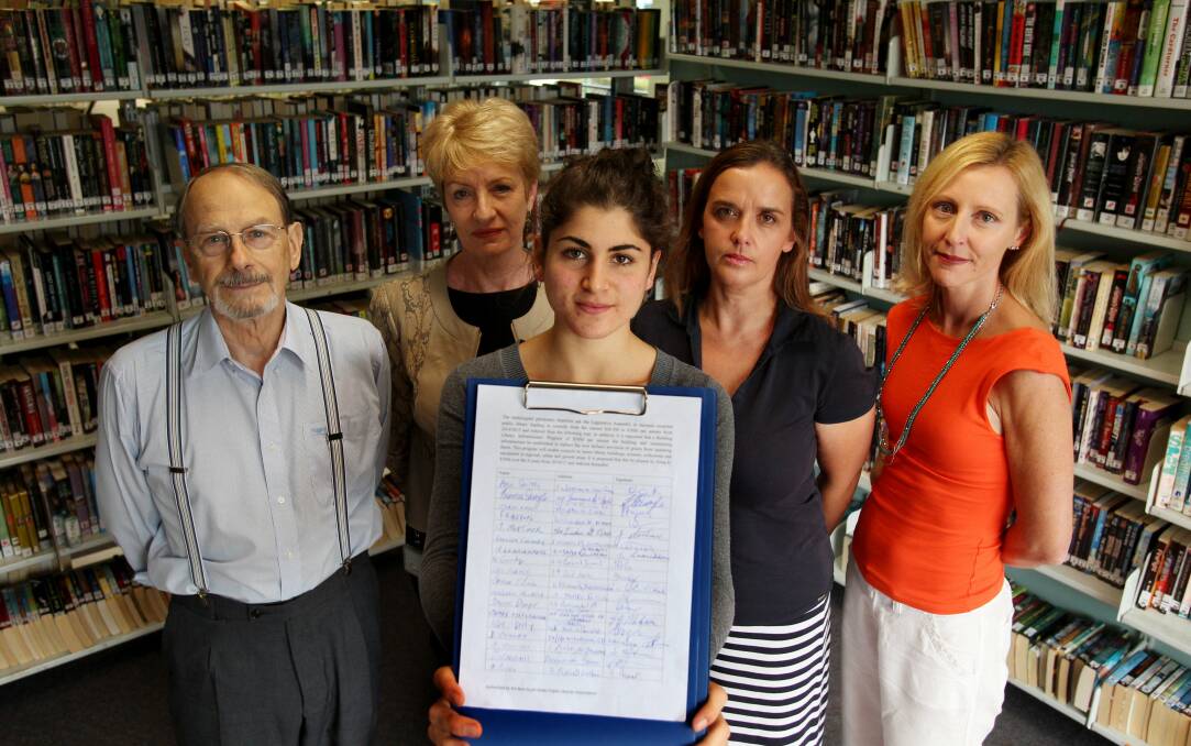 Fair deal: Sutherland Library users are urging residents to sign a petition to stop state government cuts to library funding. Pictured are (from left) Walter Ellis, library manager Lyn Barakat, Etienne Tadros, Karen Darley and Deb Fox. Picture: Chris Lane