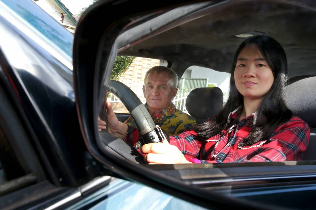 Neighbourly: Peter Mills is teaching Tong Wang to drive. Picture: Jane Dyson
