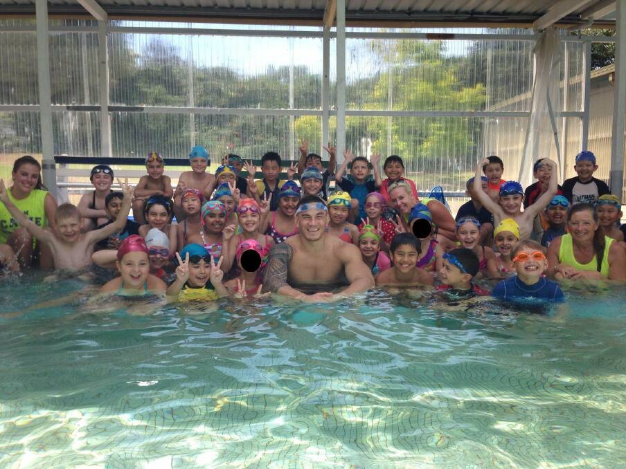 Making a splash: Sonny Bill Williams delighted the students of Blakehurst Primary when he posed for a photo after his training session at Dick Caine's pool.