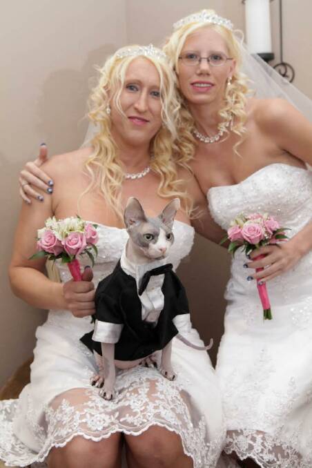 Purrfect pair: Jennifer Hendrix, Erica Nagel and Zeno suitably attired for their Vegas wedding.