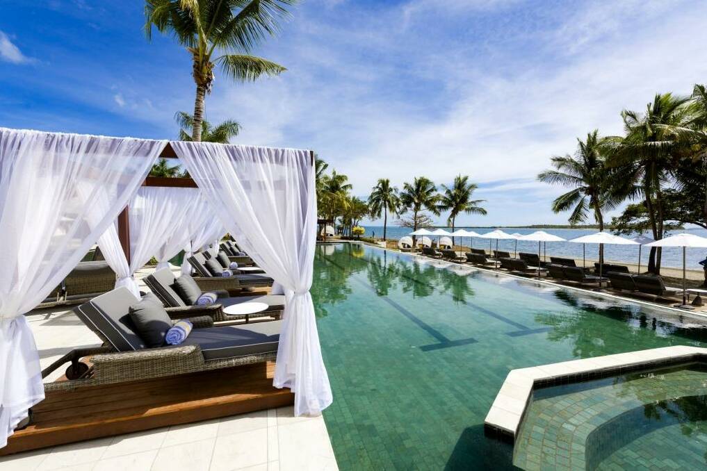 Relax poolside: Waitui Beach Club has its own pool, champagne bar, poolside cabanas, gym and restaurant. Photo: Supplied