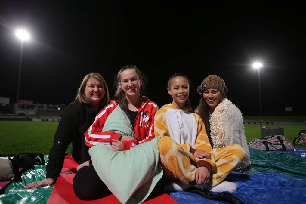 Under the stars: Michelle Gould, Emily Gould, Hayley Speziale and Jacqui Karauria at the Kogarah Community Services sleepout.Picture: Chris Lane