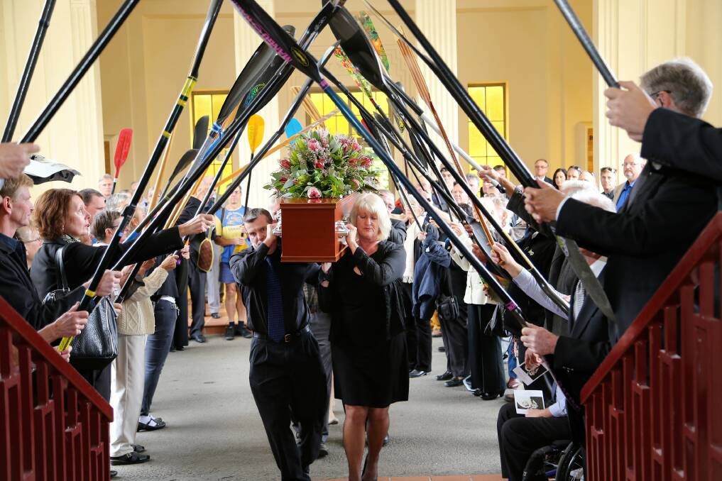 Fitting tribute: Paddling NSW, Sutherland Shire Canoe Club members form a guard of honour at the Celebration of Life of Joan Morison on Monday at Woronora. Picture: John Eades