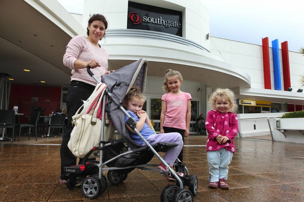 Redevelopment option: Susan Ambrose, with daughters Portia, 6, Chelsea, 4, and Chloe, 2, at Southgate Shopping Centre. Picture: John Veage