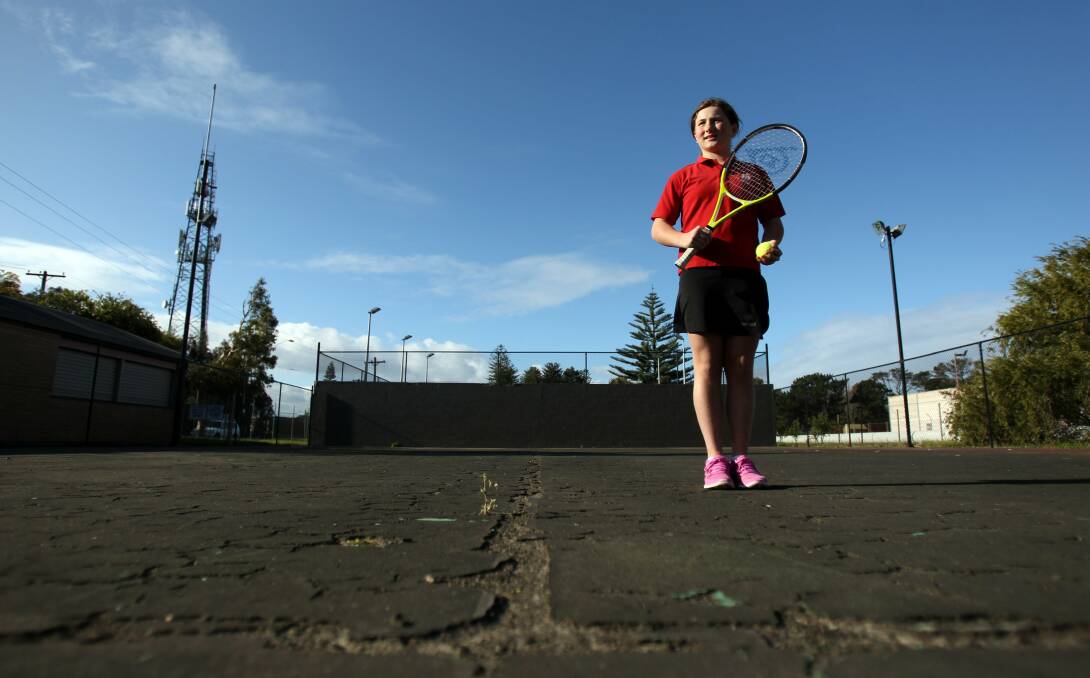 Ace announcement: Chloe Cole, 11, on the court to be replaced. Picture: Chris Lane