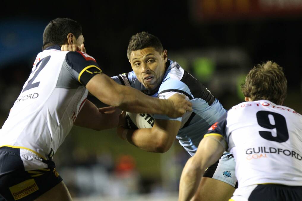 Lassoed: Sharks forward Anthony Tupou corralled last Friday night by the North Queensland Cowboys at Remondis Stadium. Picture John Veage