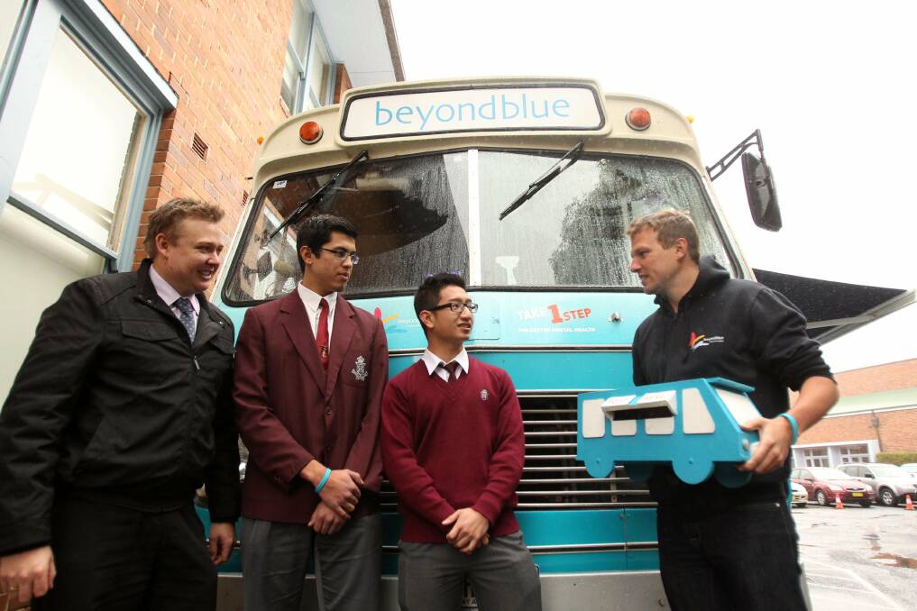 Stopover: Beyondblue's bus toured through St George this month, visiting students at Sydney Technical High School, Bexley. Teacher Kirk Grinham (left) and students Shakil Zaman and Nam Kiet Nguyen are pictured with beyondblue's Reid Sexton. Picture: Chris Lane