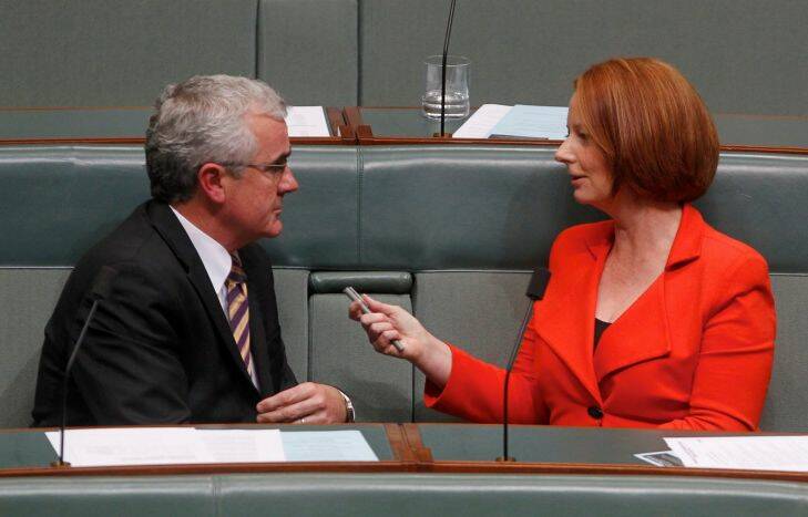 Prime Minister Julia Gillard talks with Independent Mp Andrew Wilkie at the conclusion of question time at Parliament House Canberra on Tuesday 10 May 2011. Photo by Andrew Meares / Fairfax SPECIAL 000000