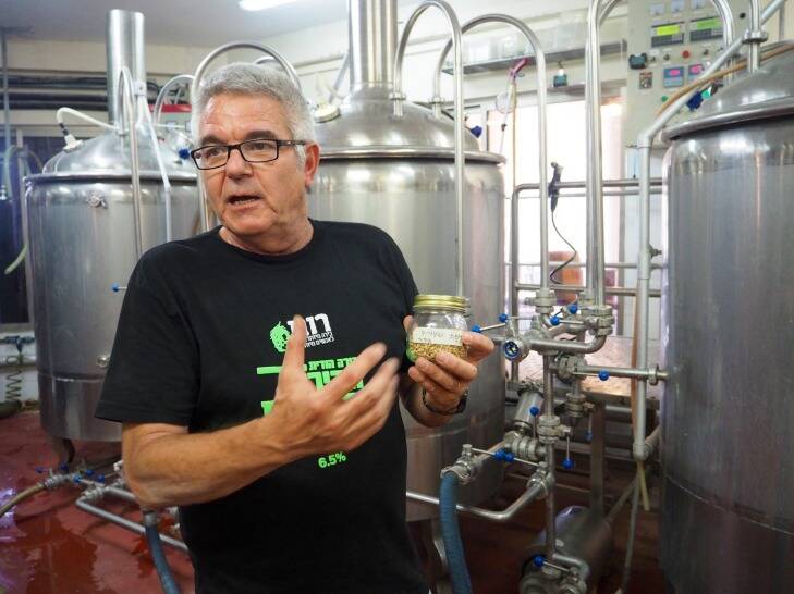 OLYMPUS DIGITAL CAMERA          Ohad Ayalon threw in his tech job to brew beer with business partner at Srigim Brewery.