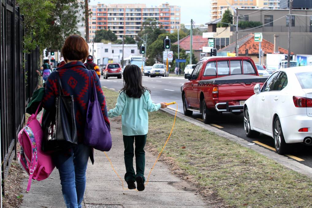 Doing the right thing:  Mothers walk pupils from Kogarah Public School to the traffic lights. Picture: Jane Dyson
