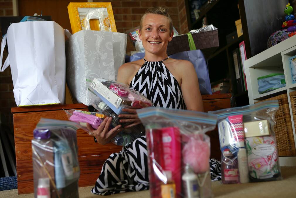 Putting a smile on the faces of women: Jen Armstrong gives toiletries to women leaving violent relationships. Picture: John Veage