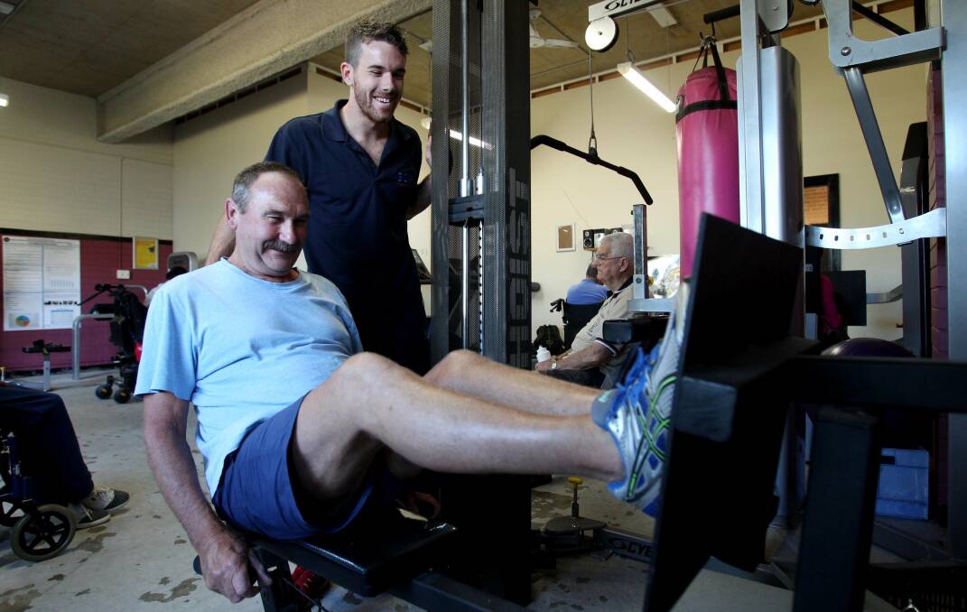 Burn Rubber Burn: Accredited exercise physiologist Kieren O'Brien puts Brian Long through his paces. Picture: Chris Lane