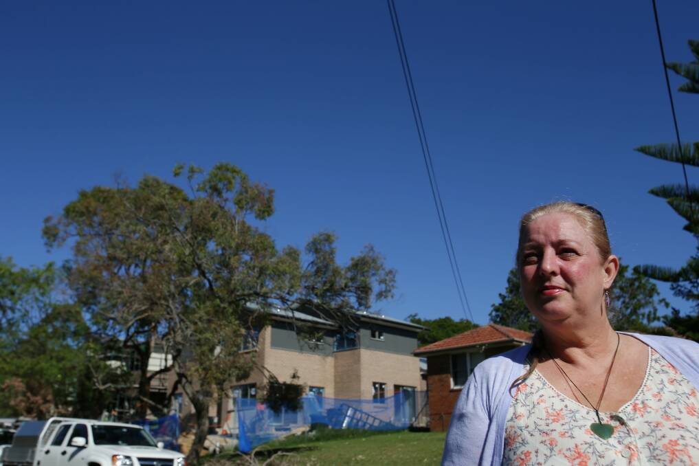 Long wait: Robyn Wennekes, who waited 15 years for social housing, welcomes a new project in her street at Gymea which has been funded from proceeds of Millers point home sales. Picture: Chris Lane
