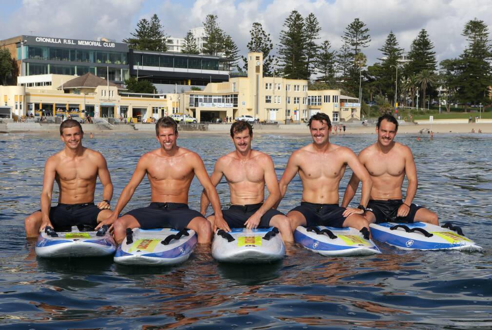 Mo worries: Sutherland Shire lifeguards are competing in a Movember lifeguard relay from Bondi to Cronulla, (left to right) Adam Calo, Mitch Allum, Joel Bolweski, Kyle O'Brien and Aaron Markey. Picture: John Veage