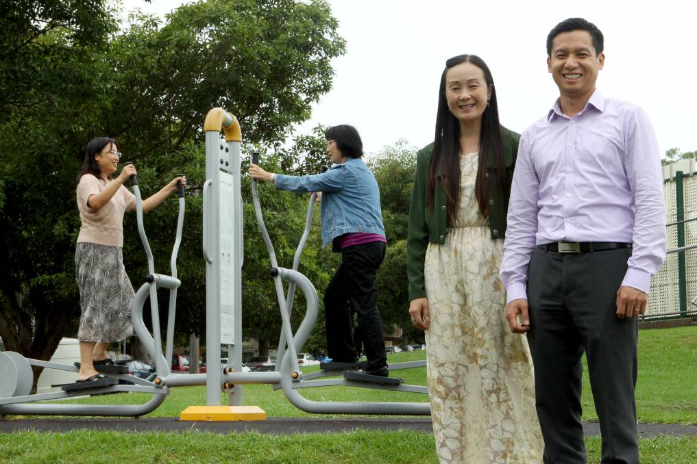 No excuse: Lydia Dang and Linda Zhu test outdoor exercise equipment for seniors. Cr Nancy Liu and Gordon Chen are planning more such equipment. Picture: Jane Dyson
