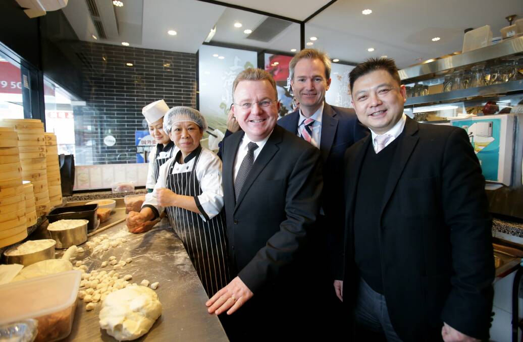 Opportunities: Federal Minister for Small Business Bruce Billson with Taste of Shanghai owner Aaron Mi and Banks MP David Coleman with staff from Taste of Shanghai  before attending a Hurstville seminar on the China free trade agreement. Picture: Chris Lane