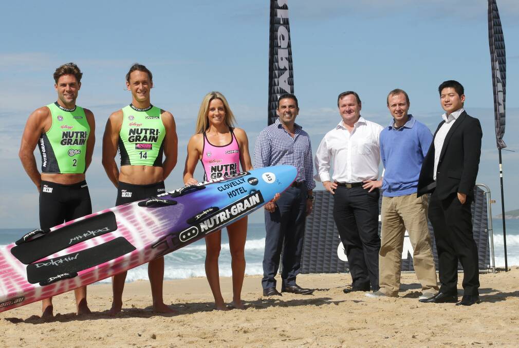 Crest of a wave: Nutri-Grain Ironman and Ironwoman Series will return to North Cronulla Beach in January. (From left) competitors Kendrick Louis, Ali Day and Tara Coleman with Sutherland Shire councillors Carmelo Pesce, Kent Johns, Scott Williams and Nutri-Grain senior brand manager Jeci David. Picture: John Veage