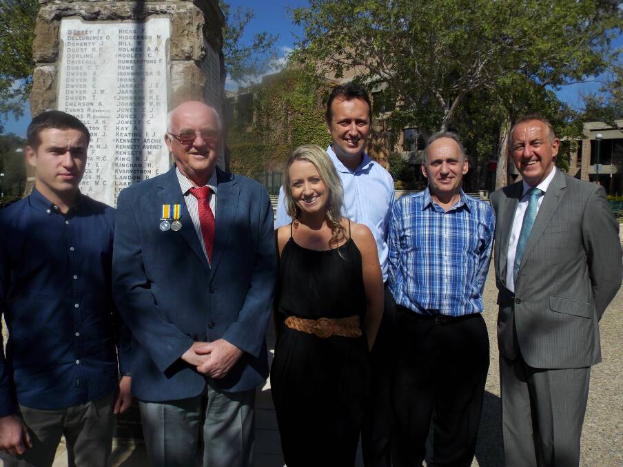 Sacrifice: The Tierney family gather in memory of grand uncle Patrick Lydon. (Left to right) Jack (Michael's son), John Tierney (wearing Patrick's medals), Sinead and Liam (Frank's children), and Michael and Frank Tierney, at Sutherland war memorial.