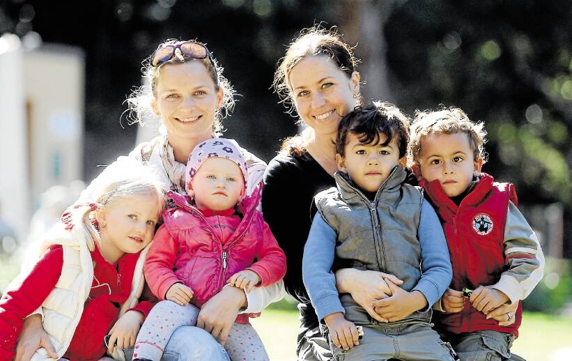 Budget pain: Maria Slovakova (left) with her children, Emily,4, and Julia, 1, and Helena Agaibi with twins, Aiden and Jesse, 3, have mixed feelings about  the upcoming federal budget.
Ms Slovakova, of Ramsgate Beach, said she was concerned family assistance could be cut.

"People get to rely on it, and it helps mothers to stay home and look after their children," she said.

Ms Agaibi, of Sans Souci, believes a Medicare co-payment could be justified "as long as it is not so big it deters people with a genuine need".

Both women would like to see a paid parental scheme with much lower payments, but over a longer period. Picture: Chris Lane