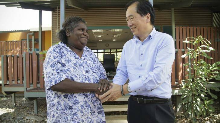 Annie Ngalmirama greets former Japanese Prime Minister Naoto Kan in Jabiru, Kakadu National Park. Photo: Dominic O'Brien