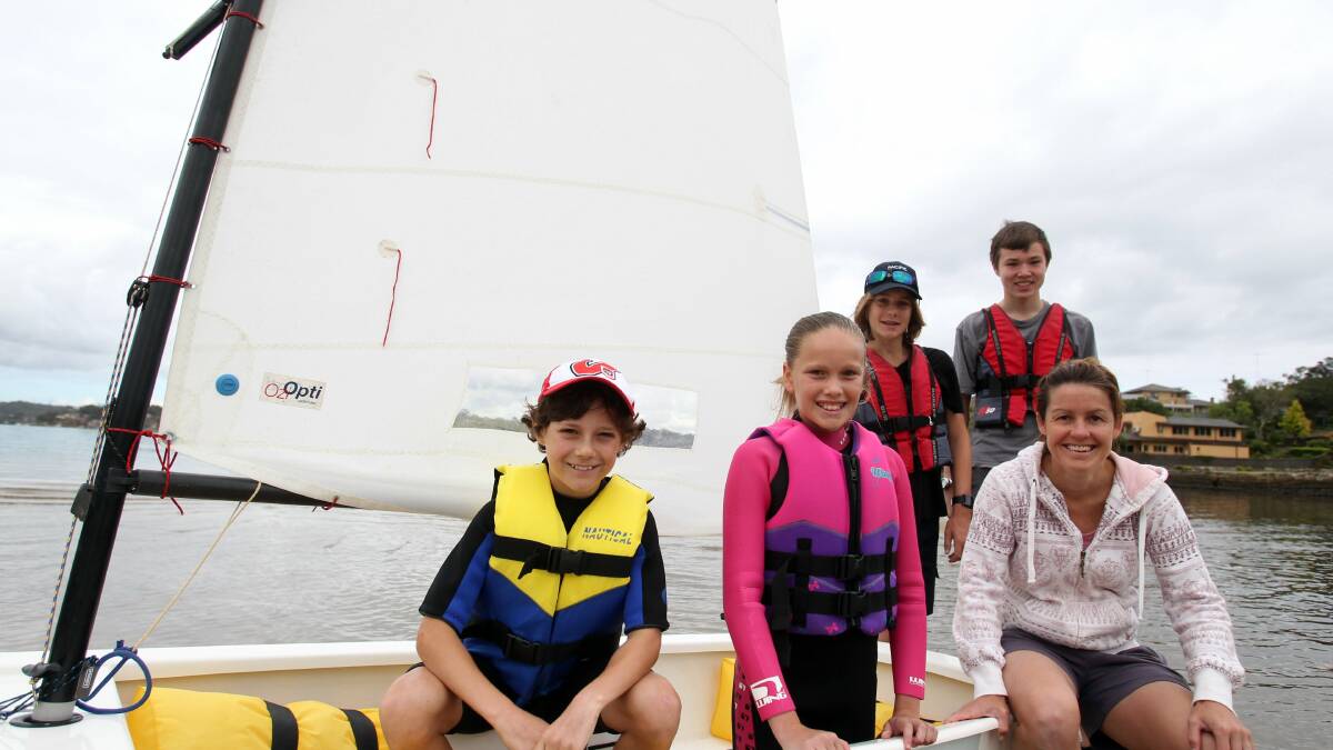 On calm waters: Connells Point Sailing Club learn to sail day with Thomas Henwood, Jaime Greig, Sam Ebenezer, Cameron Gordon and Karen Branch at Donnelly Park, Kyle Bay. Picture: Chris Lane
