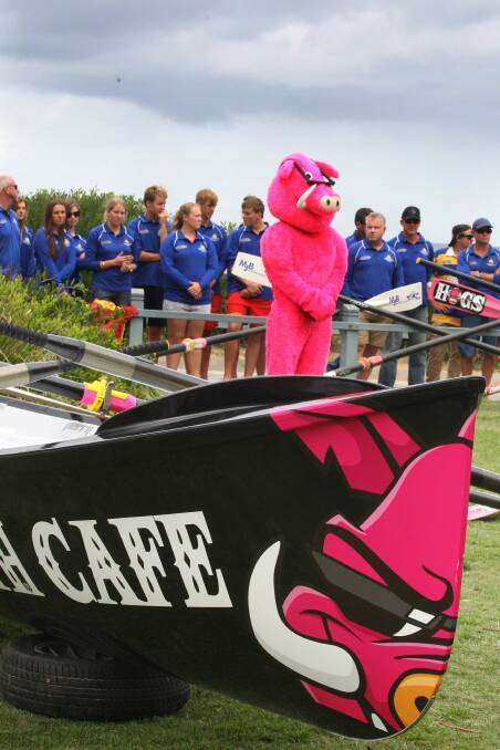 Prowess: The Hog's Breath mascot at the launch of the new surf boats. Picture: John Veage