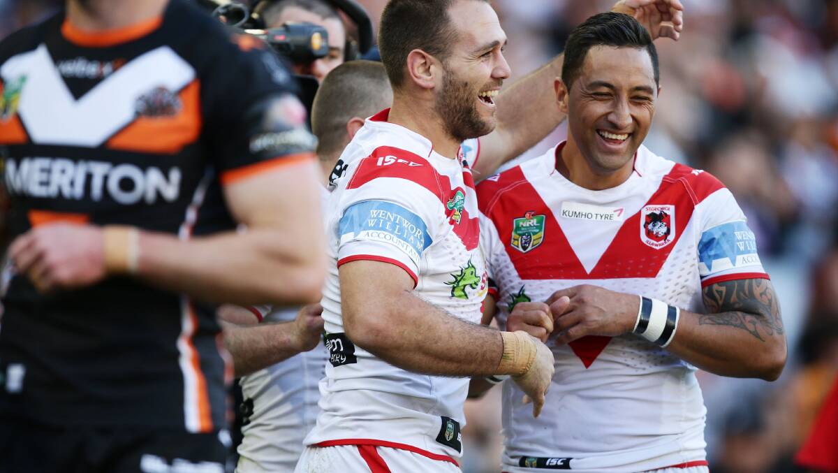 Smiles all round: Benji Marshall (right) congratulates Jason Nightingale after the winger's try at ANZ Stadium. Picture: Matt King, Getty Images