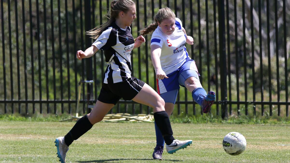 Triumph: Miranda Magpies under-18s girls' team (black and white) defeated Epping YMCA 2-0 in the semi-final on Sunday at Harrie Dening Centre, Kareela. Pictures: John Veage