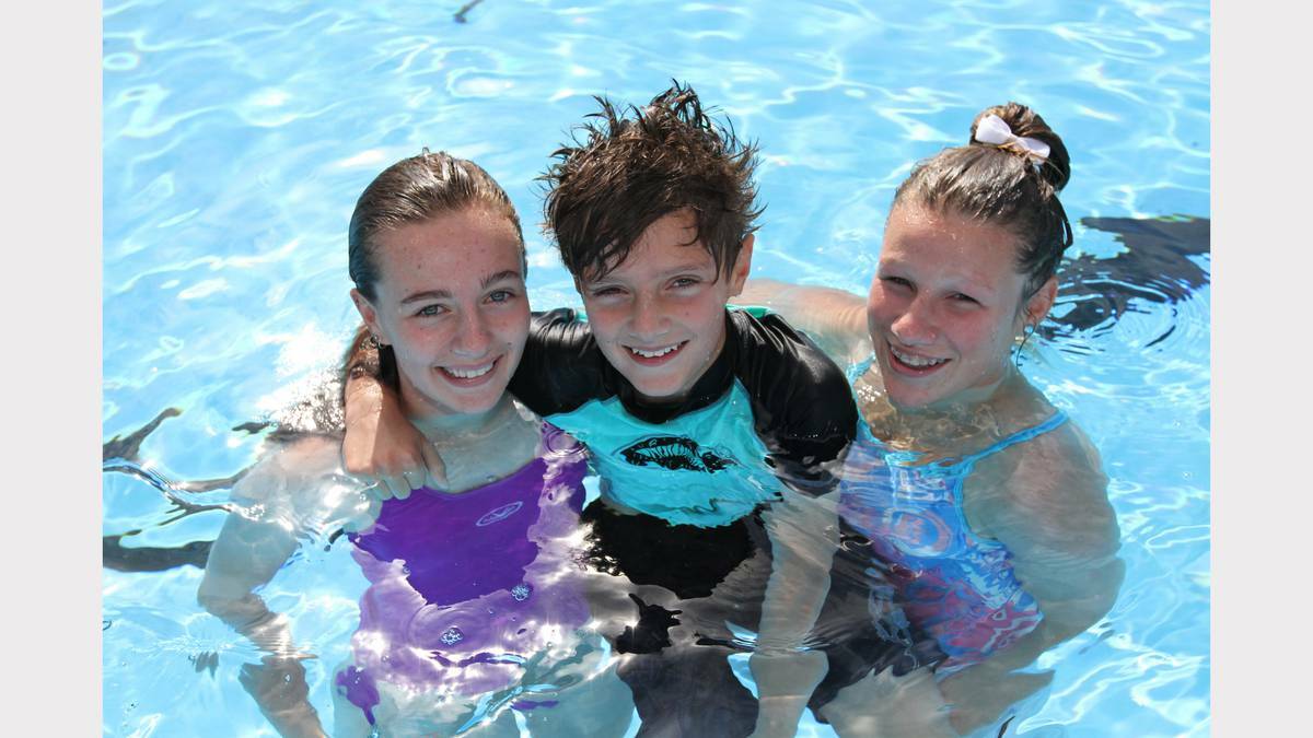 THE ADVOCATE (Burnie) - Shannon and Joseph Munton and Taylah Lynd all of Ulverstone enjoy a dip at the official opening of the Splash Aquatic and Leisure Centre.