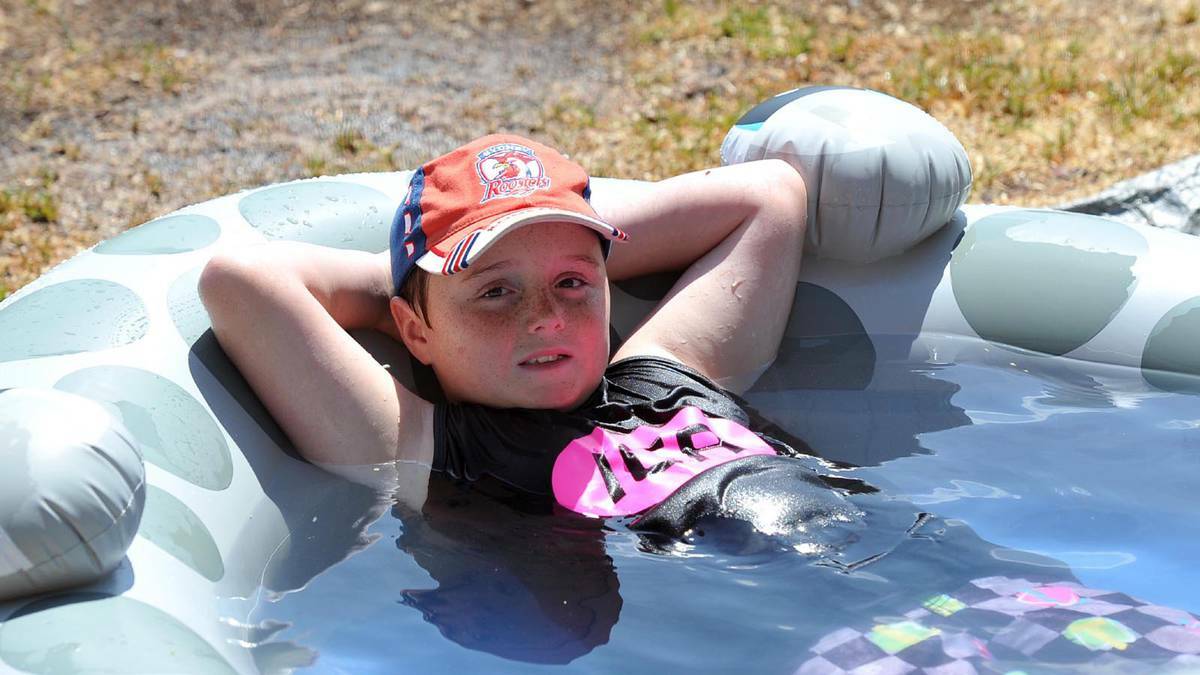 DAILY ADVERTISER (Wagga Wagga) - Logan Holston, 8, cools down between games at the Cootamundra touch carnival at the weekend. Picture: Michael Frogley