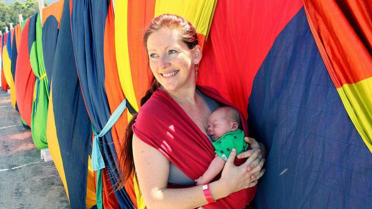 ILLAWARRA MERCURY - Shane Moon with her two-day-old baby girl, Harriet, the youngest Illawarra Folk Festival-goer. Picture: KIRK GILMOUR