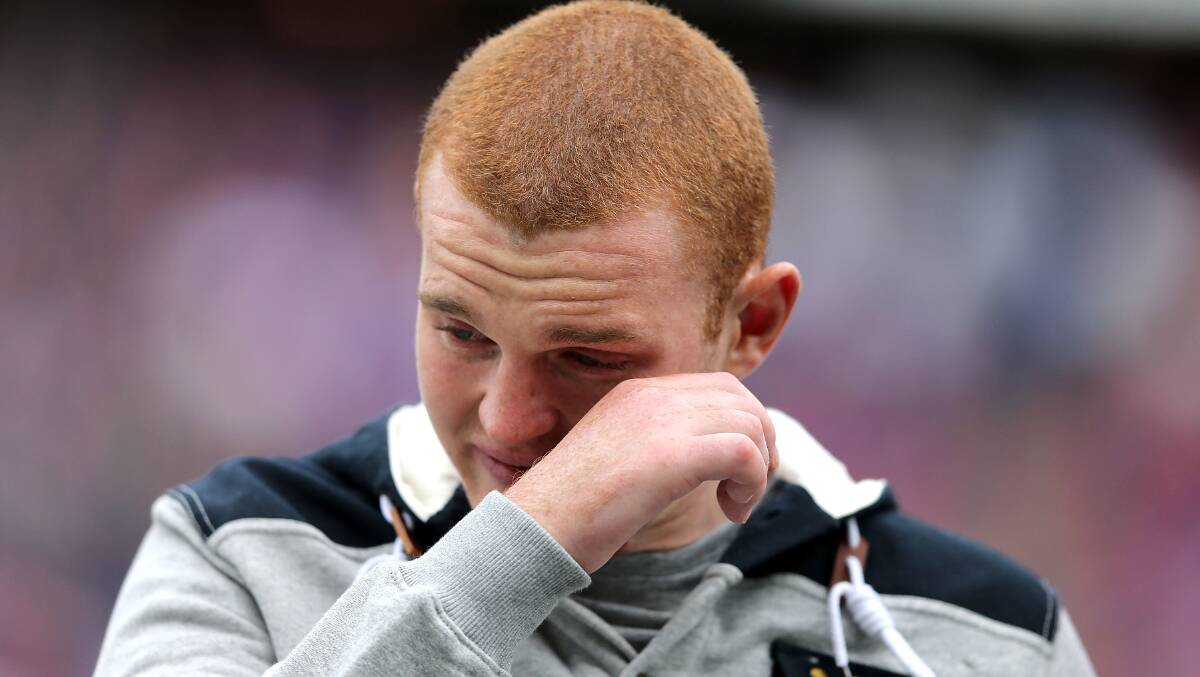 At the NRL Round 19 match between Knights and Titans - Alex McKinnon overcome by support in the #RiseForAlex round. By: Ashley Feder, Getty Images Sport.