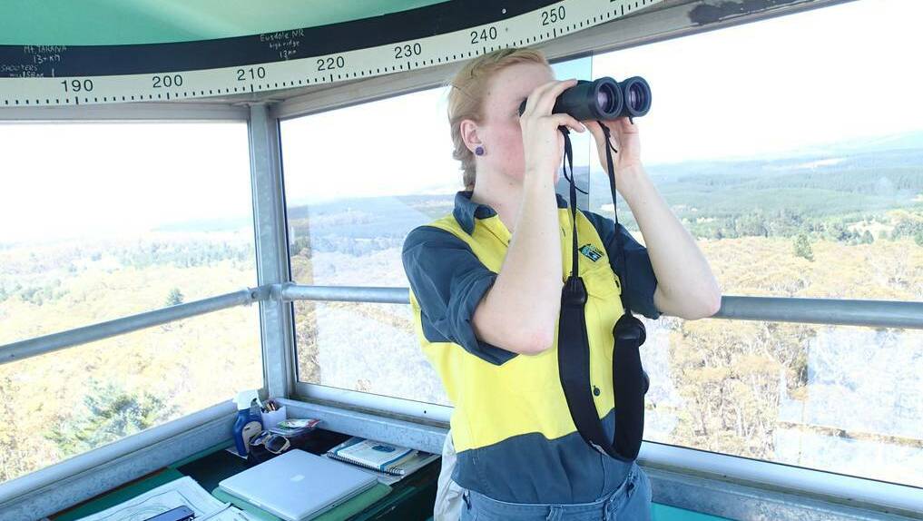 WESTERN ADVOCATE (Bathurst) - Fire tower operator Caitlin Knight keeps a close eye on the Sunny Corner State Forest. Photo: DAVE ANDERSON 