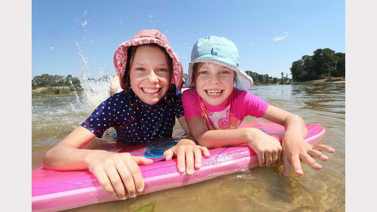 BORDER MAIL (Albury-Wodonga) - Sisters Annabele and Clare Martinae, aged 10 and 7, cool off at Beechworth.