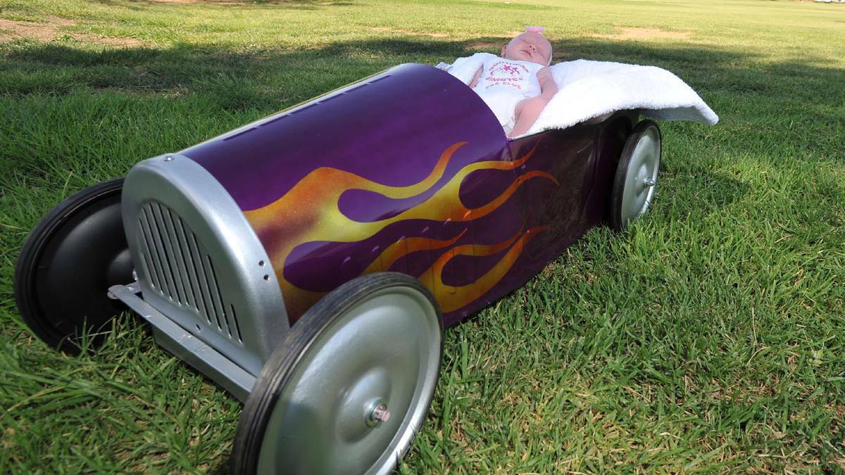DAILY ADVERTISER (Wagga Wagga) - Three-week-old Sophia Dumughn has a snooze in the car built by dad Luke at the Southern Sinister Car Club meeting at Bolton Park. Picture: Michael Frogley