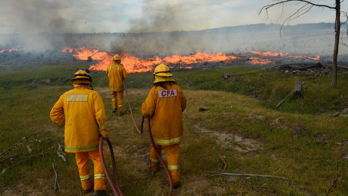 Firefighters battle the blaze near Snake Valley. PIC: ADAM TRAFFORD