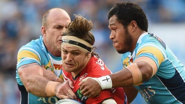 Mitch Rein of the Dragons takes on the Titans defence at Cbus Super Stadium on the Gold Coast. Photo: Matt Roberts.