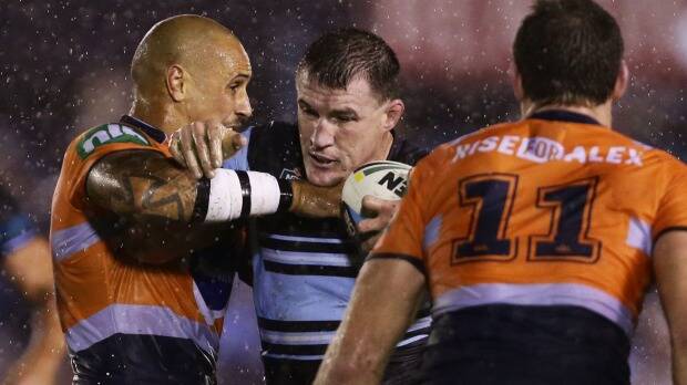 Signing priority: Sharks skipper Paul Gallen charges into the Newcastle defence. Photo: Matt King
