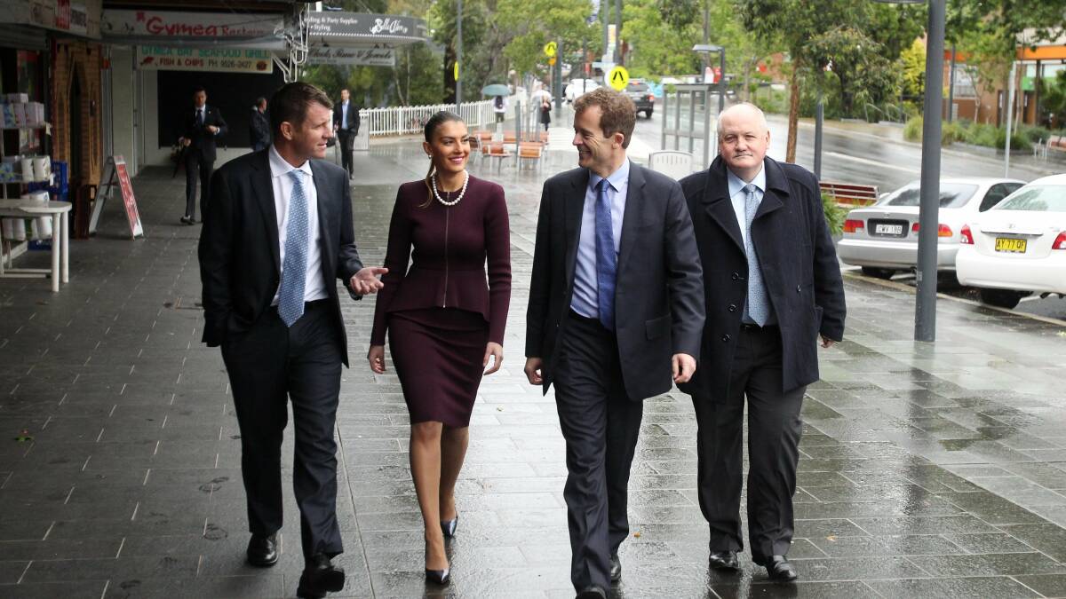 Off and running: Premier Mike Baird (left), Eleni Petinos and MPs Mark Speakman and Lee Evans take a stroll through Gymea. Picture: Chris Lane
