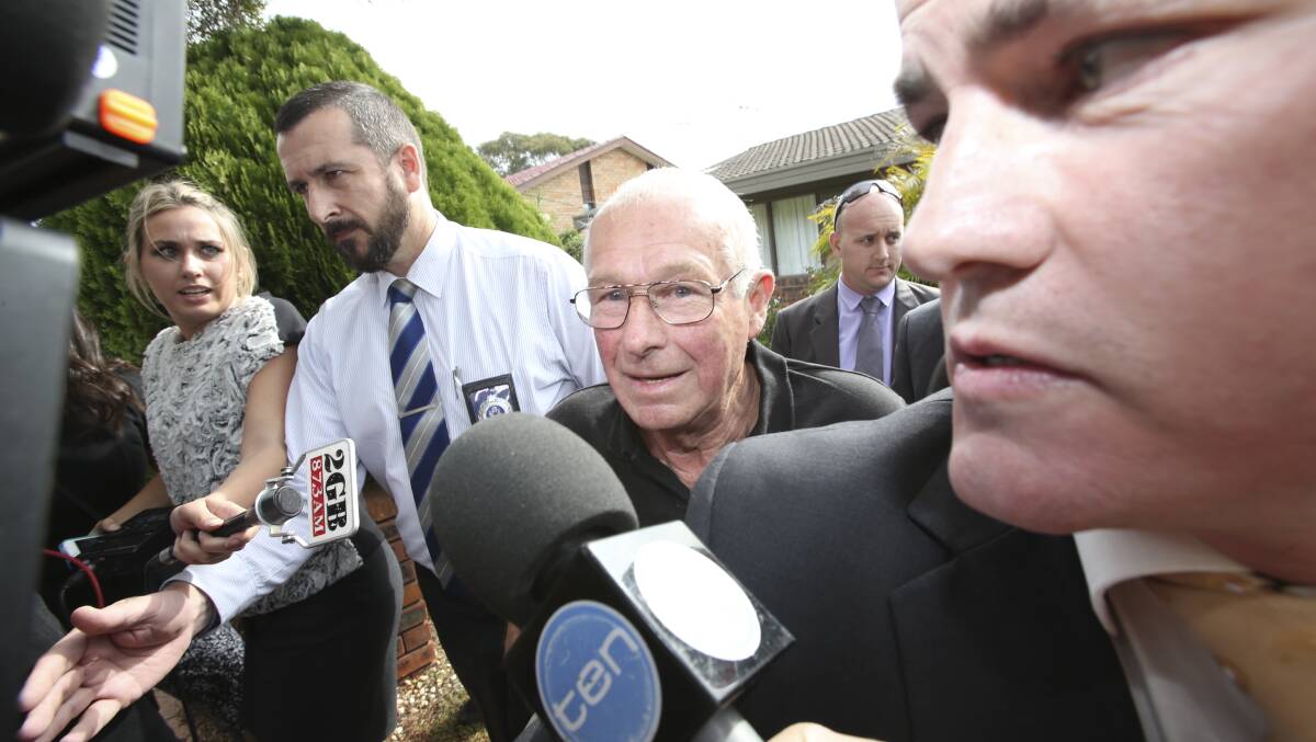 Failing health: Roger Rogerson (centre) being arrested by police at Padstow Heights in May 2014. Picture: Nick  Moir


