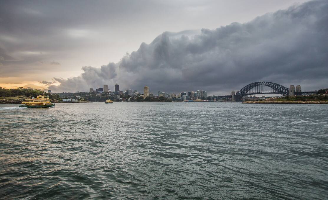 The storm rolls in over Sydney Harbour. Photo: Cole Bennetts

