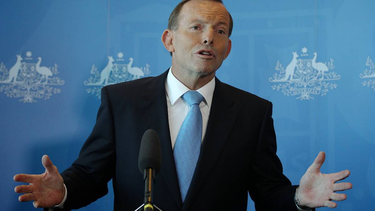 Prime Minister Tony Abbott is standing by Immigration Minister Scott Morrison. Picture: Alex Ellinghausen
