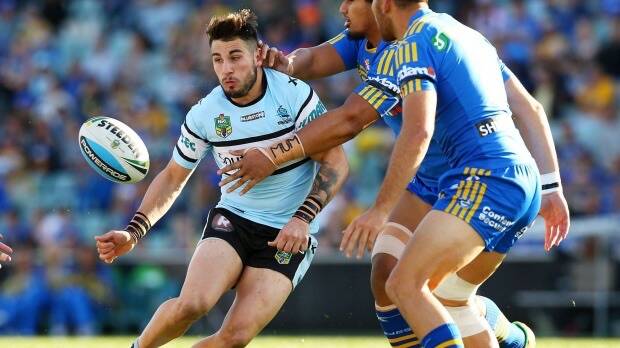 Flying Shark: Jack Bird offloads with time to spare. Photo: Getty Images